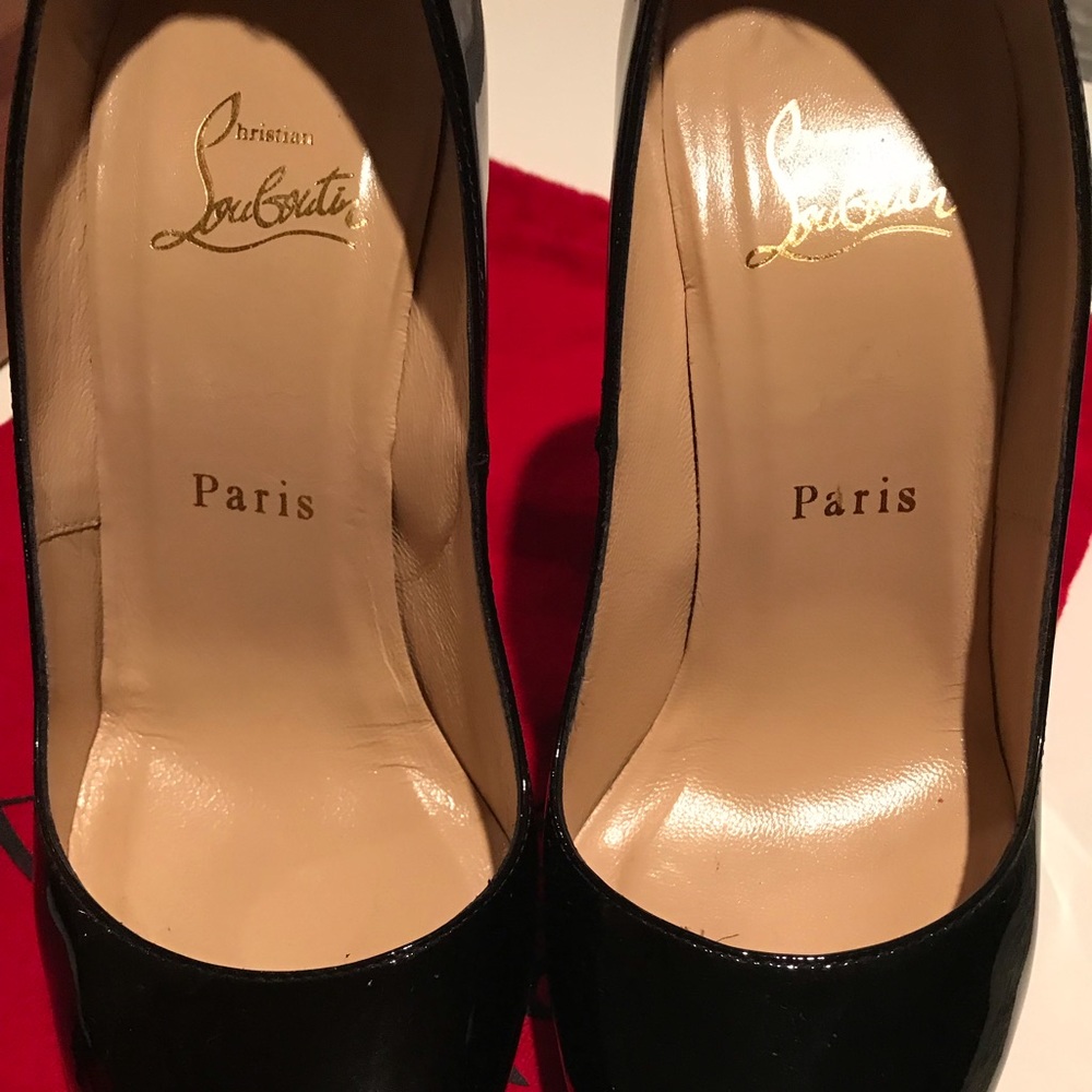 Christian Louboutin black patent leather shoes.